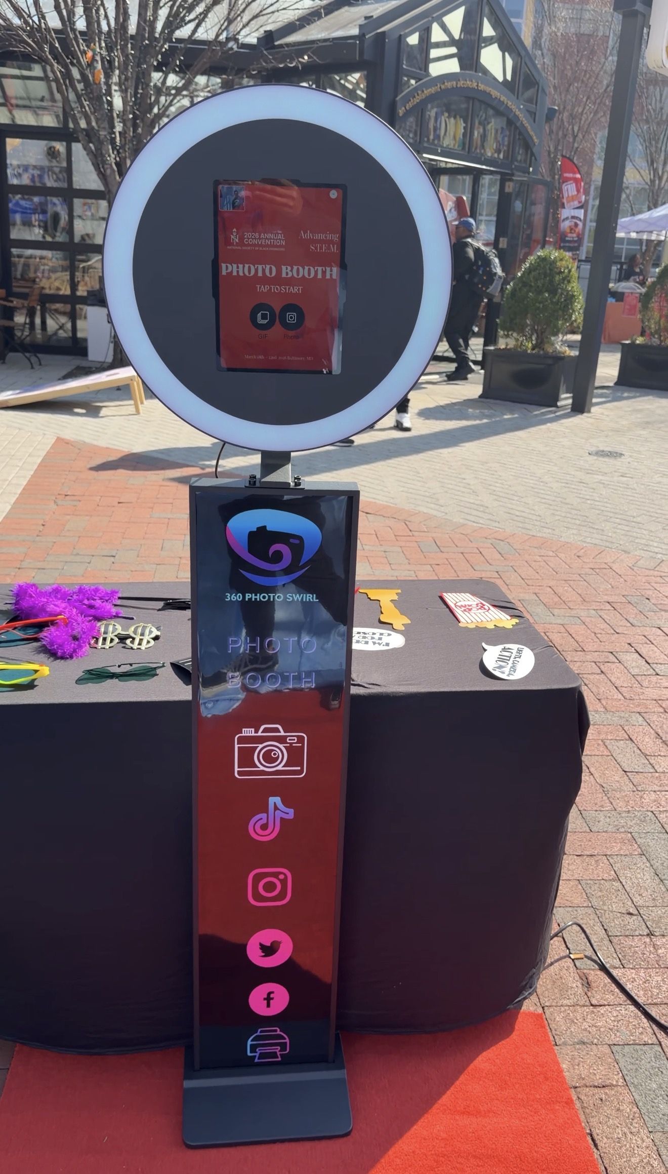 Standard Tower photo booth with red ring light at an outdoor STEM conference