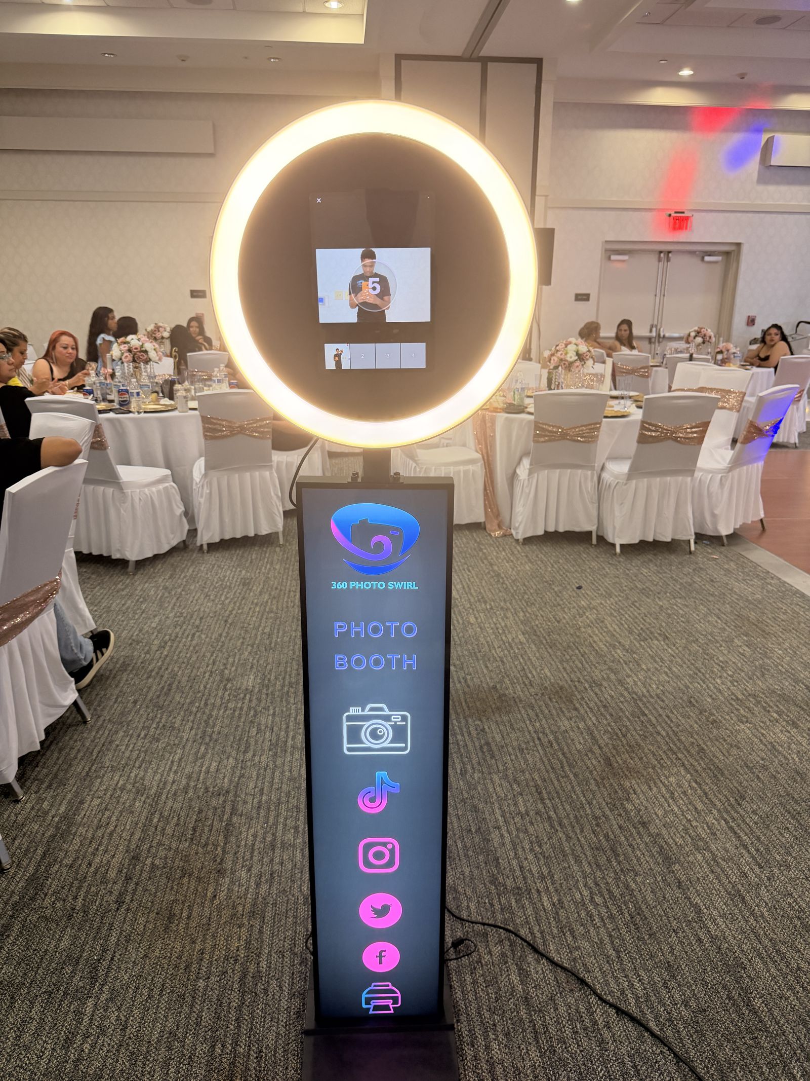 Standard Tower photo booth with warm ring light at a wedding reception