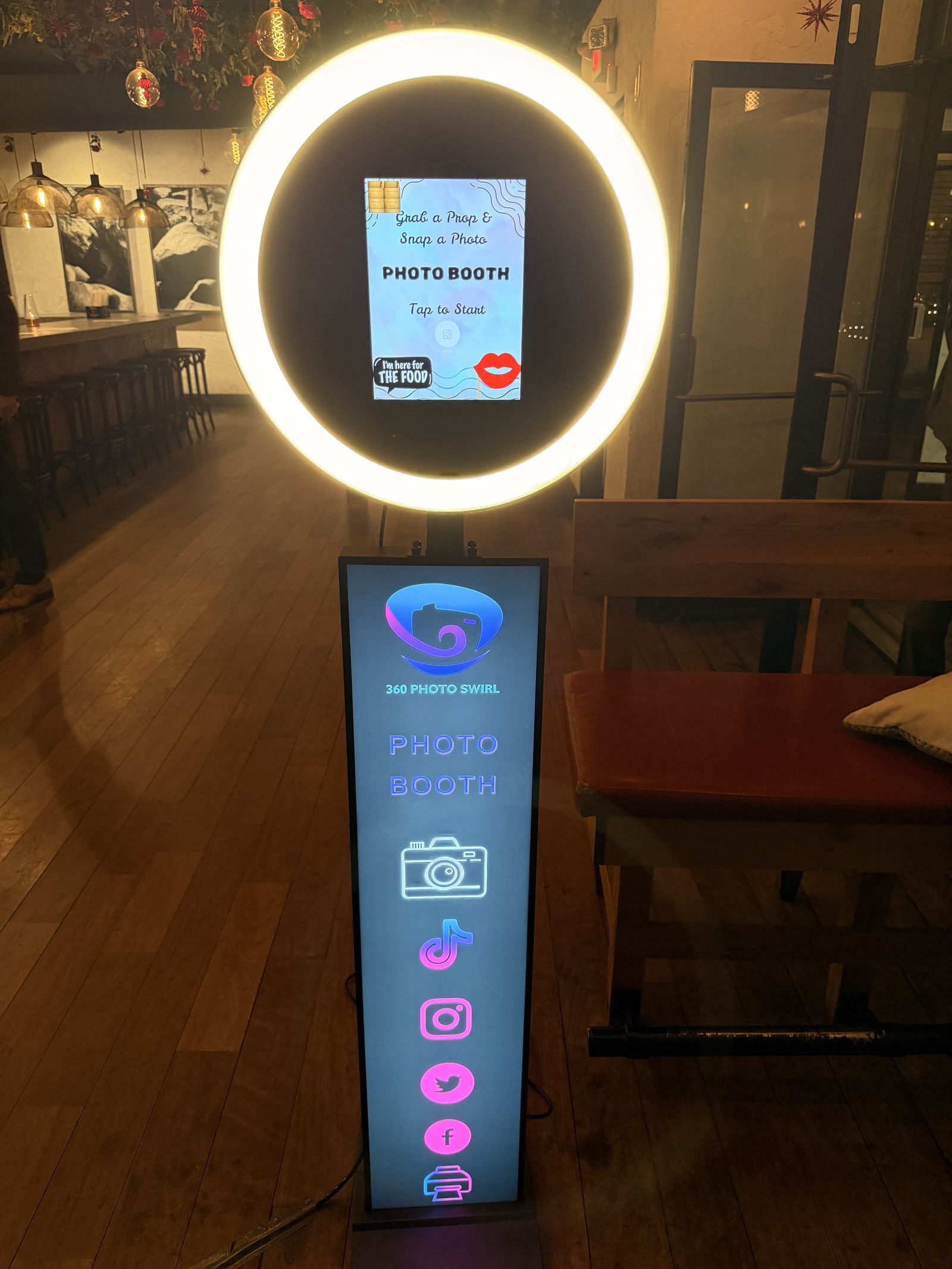 Standard Tower photo booth glowing warmly inside a wine bar and restaurant